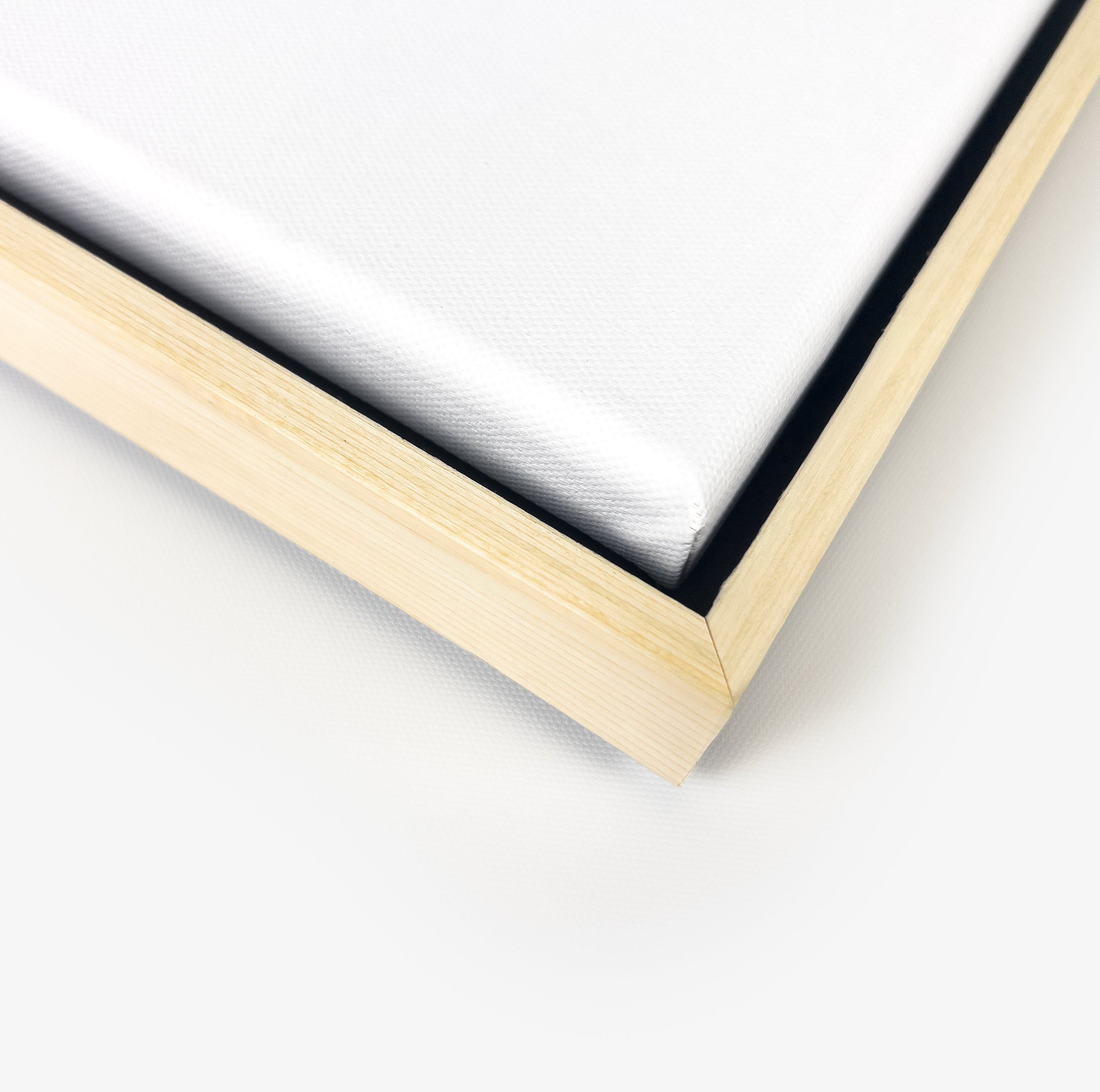 Premium canvas in a natural wood floating frame, showcasing clean joinery and fine texture.
